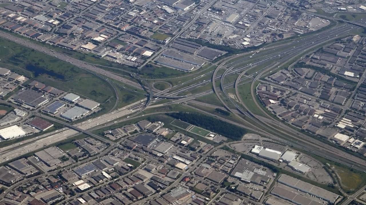 Aerial view of the Ontario Highway 401/403/410 interchange loops with traffic flowing on the ramps.
