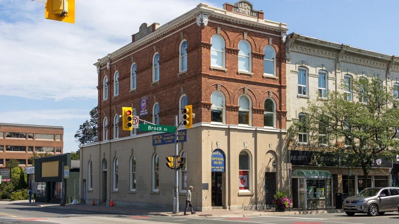 The historic Dominion Bank building on Brock Street in downtown Whitby on a clear day; no identifiable people.