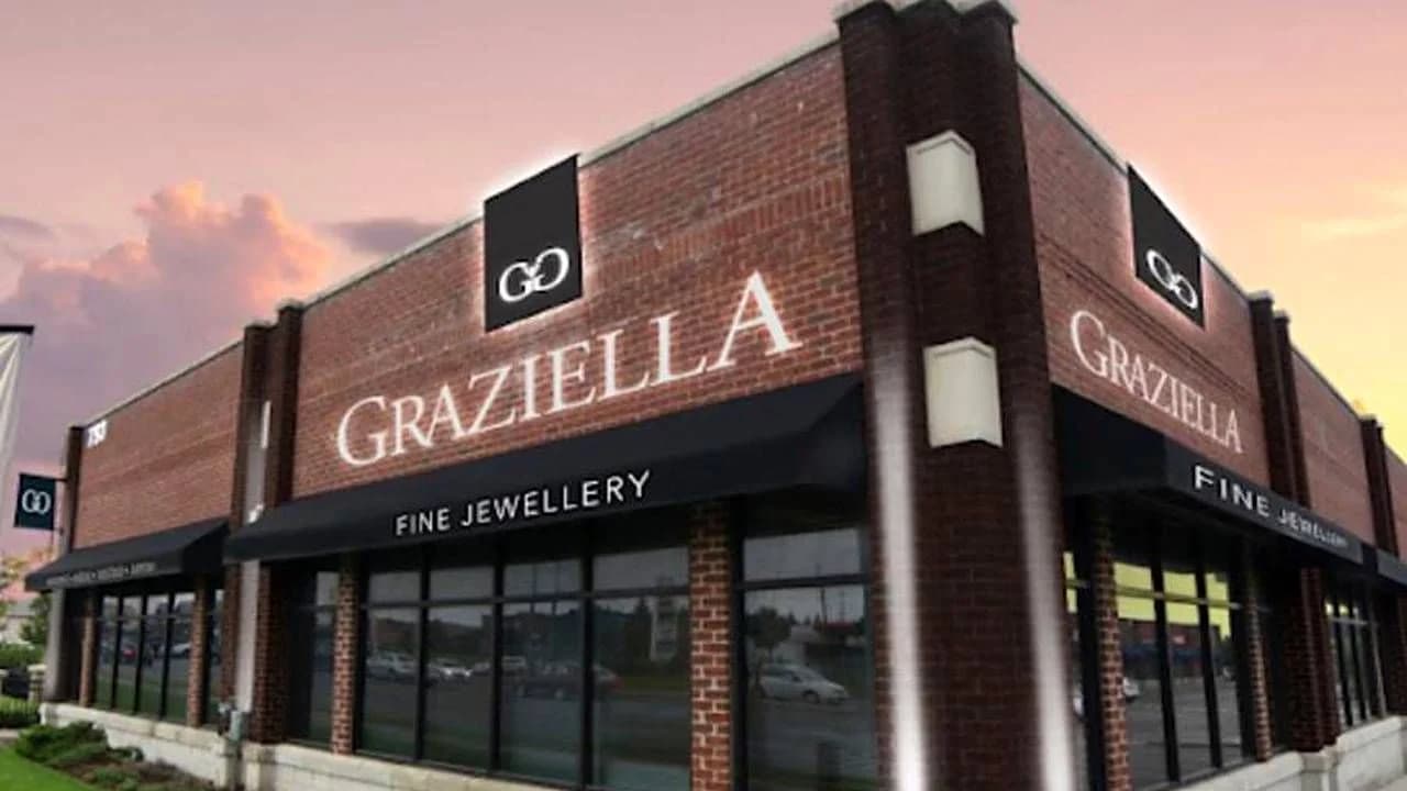 The Graziella Fine Jewellery storefront at dusk, a brick building with illuminated signage.